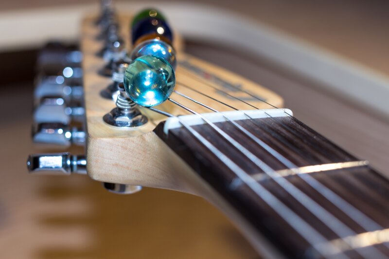 guitar headstock with marbles