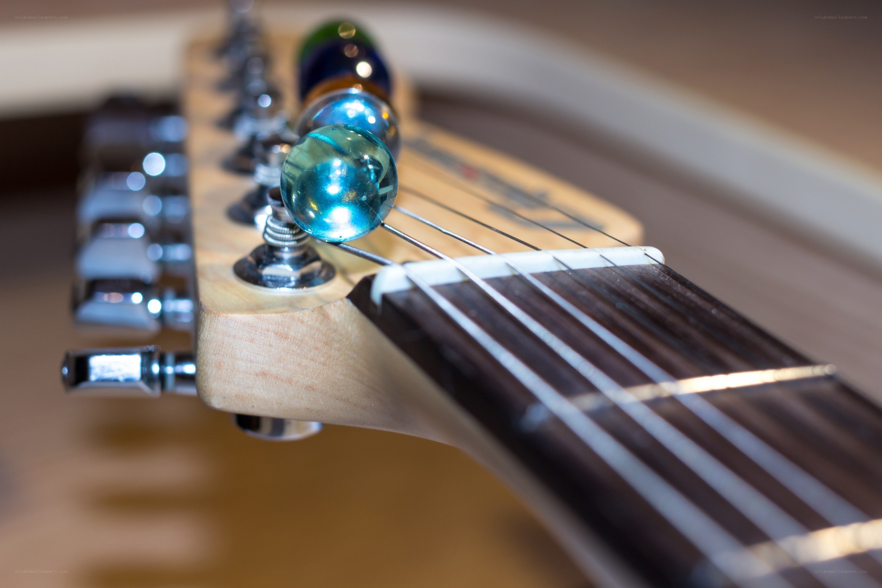 guitar headstock with marbles