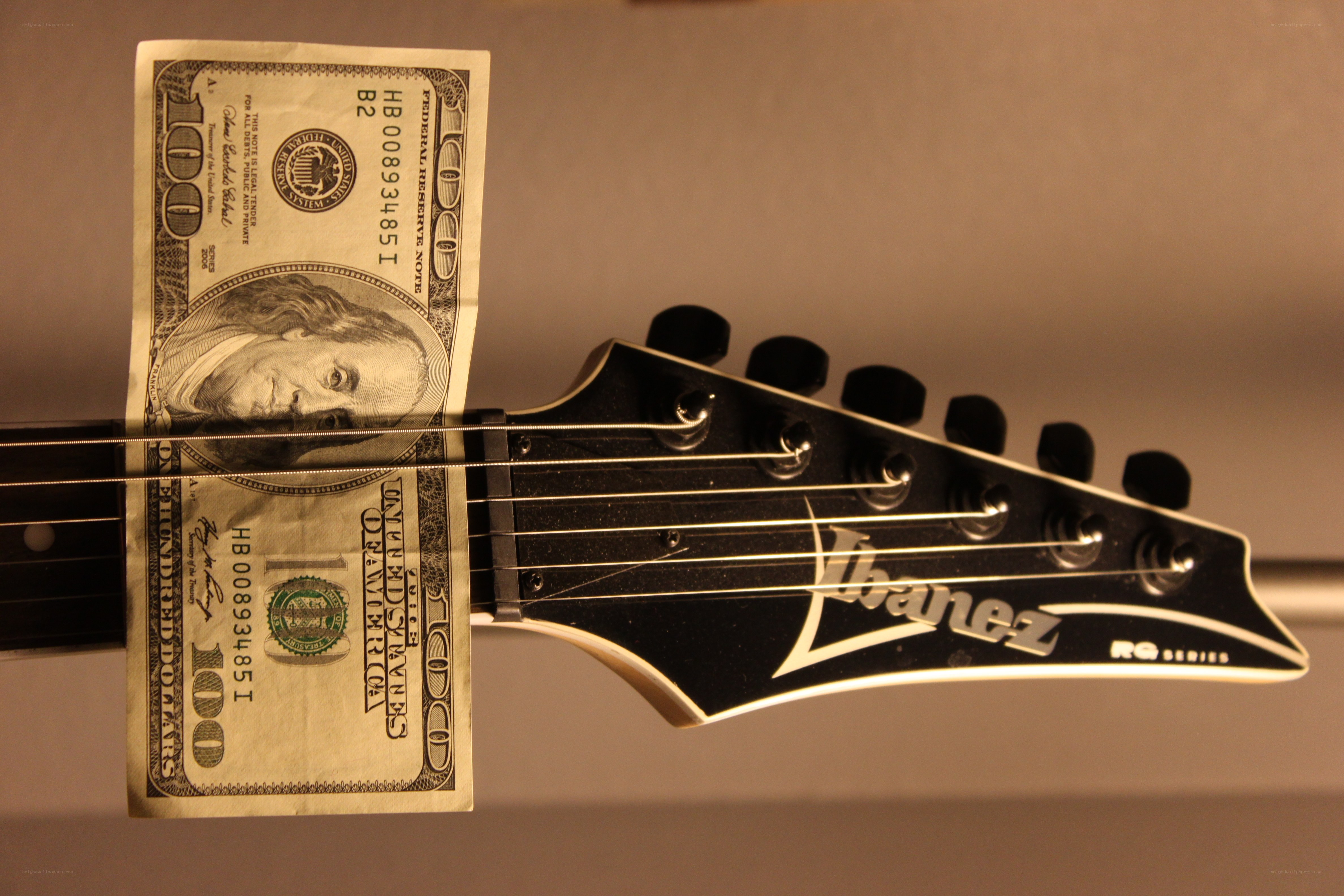 Guitar headstock with money