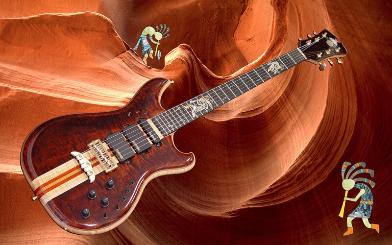 guitar in canyon with kachina figures