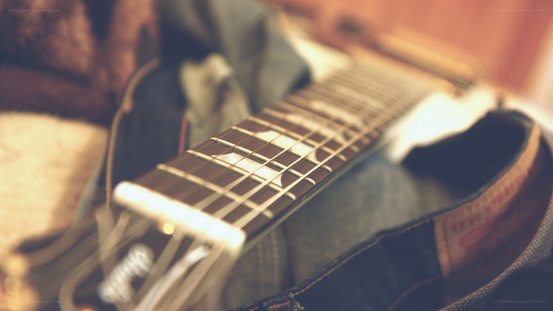 guitar neck on denim