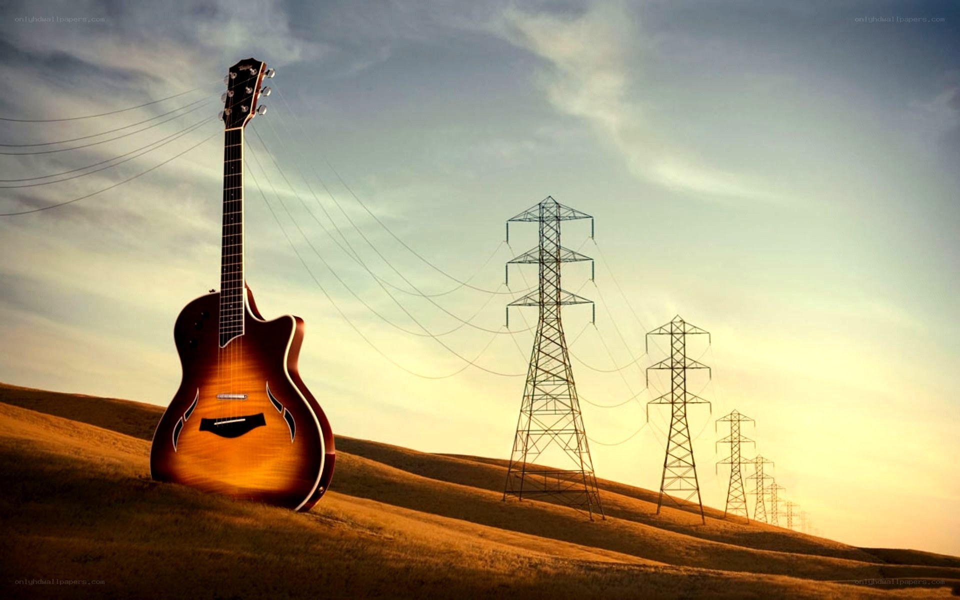 Guitar on a hill at sunset