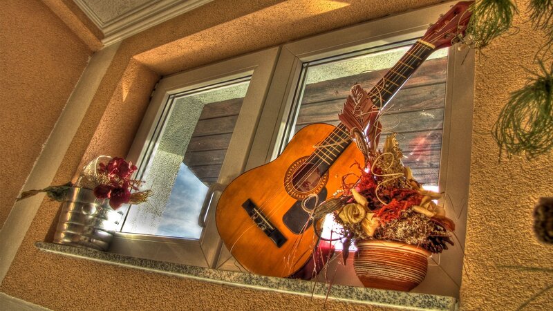 Guitar on a windowsill