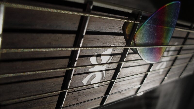 Guitar strings and pick close-up