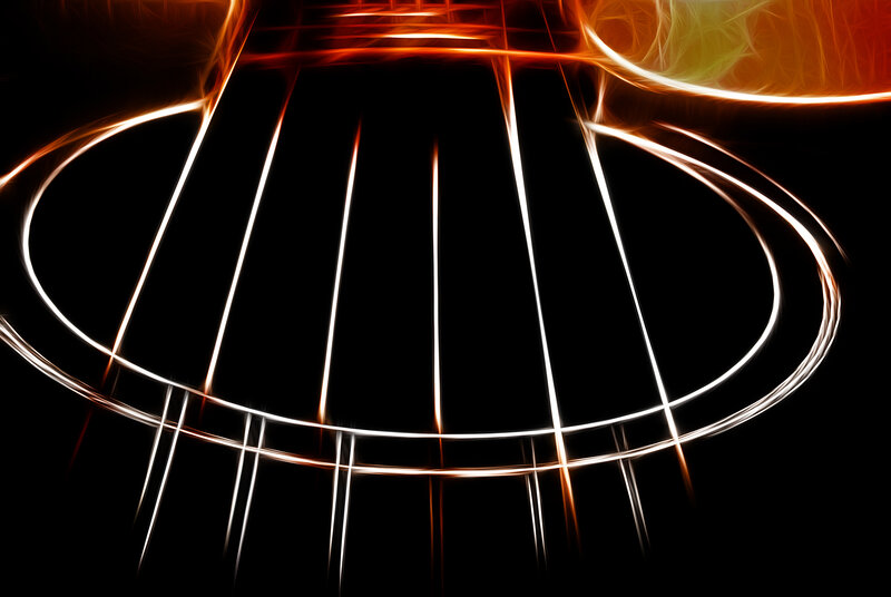 Guitar strings glowing with light