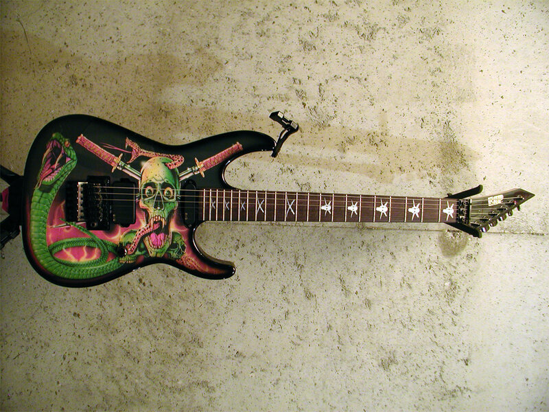 guitar with skull and snake design