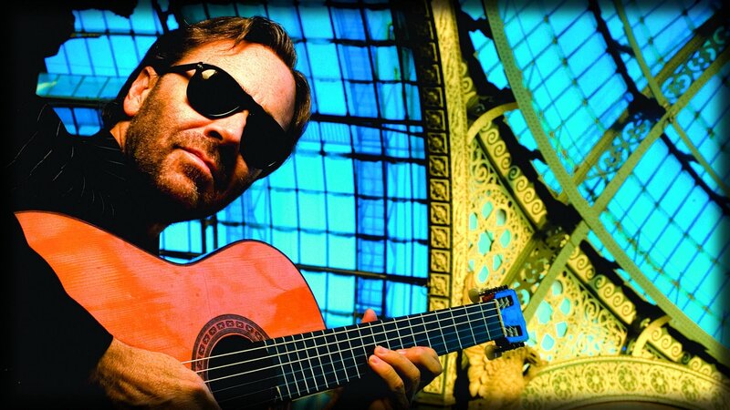 guitarist in sunglasses at glass hall
