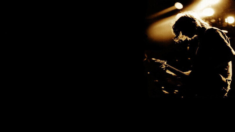guitarist on stage at night