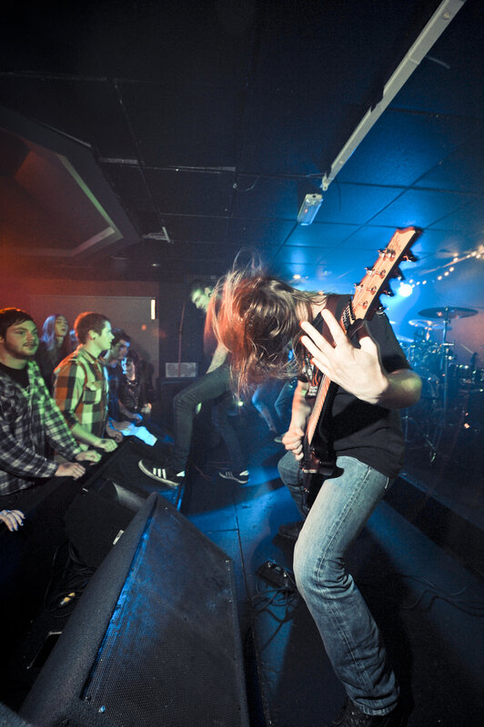 Guitarist performing at a concert