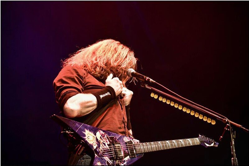 Guitarist Performing on Stage — Purple