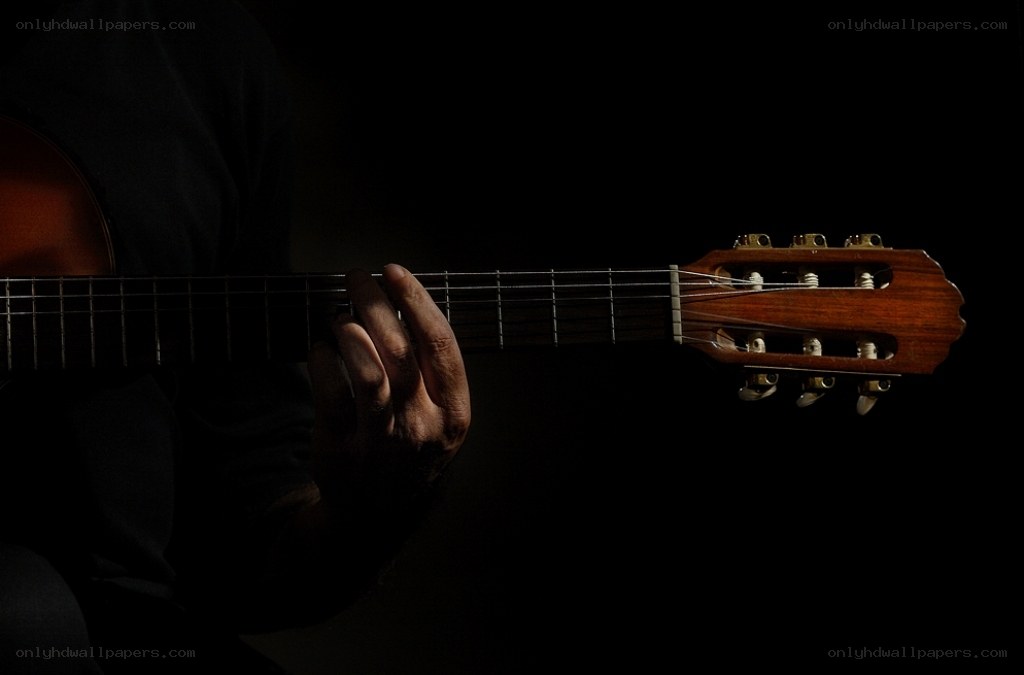 guitarist playing classical guitar
