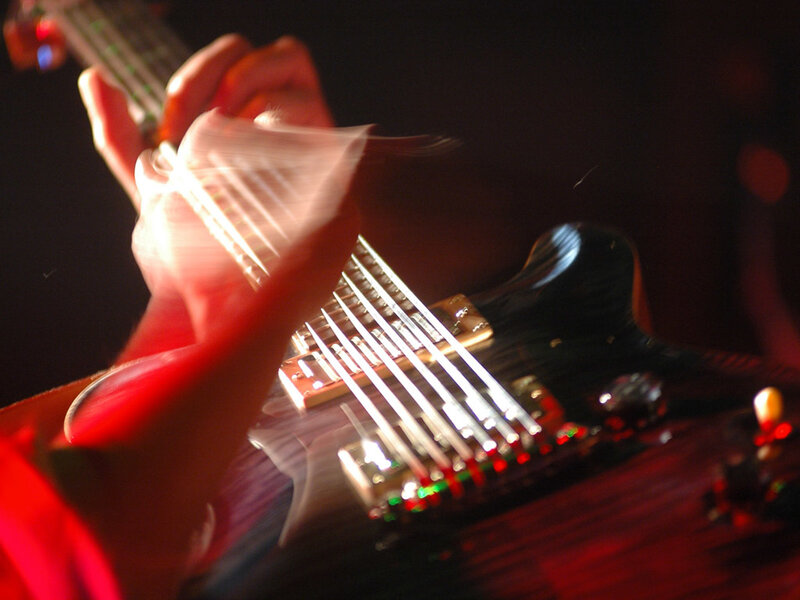 guitarist playing electric guitar