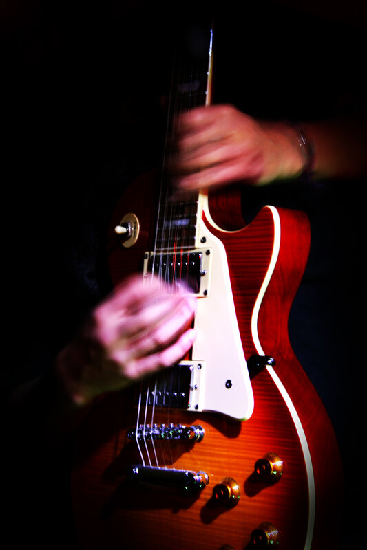 guitarist playing electric guitar