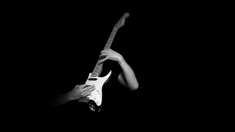 guitarist playing electric guitar