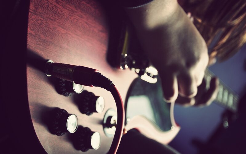 guitarist playing electric guitar