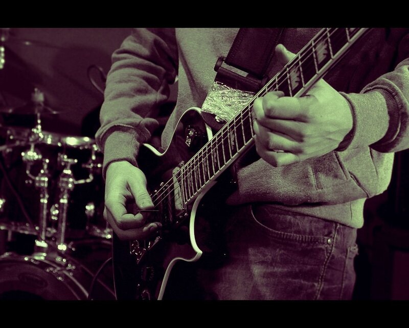 guitarist playing electric guitar