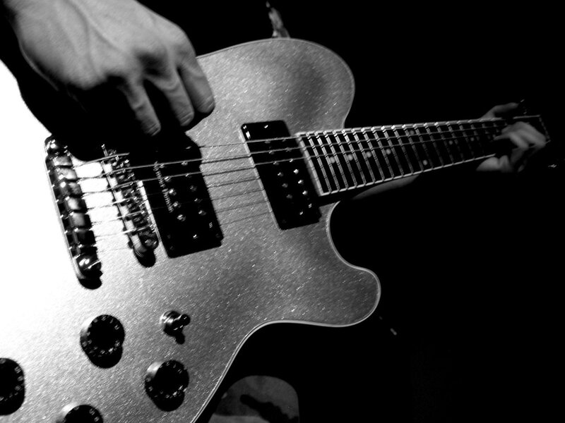 guitarist playing electric guitar