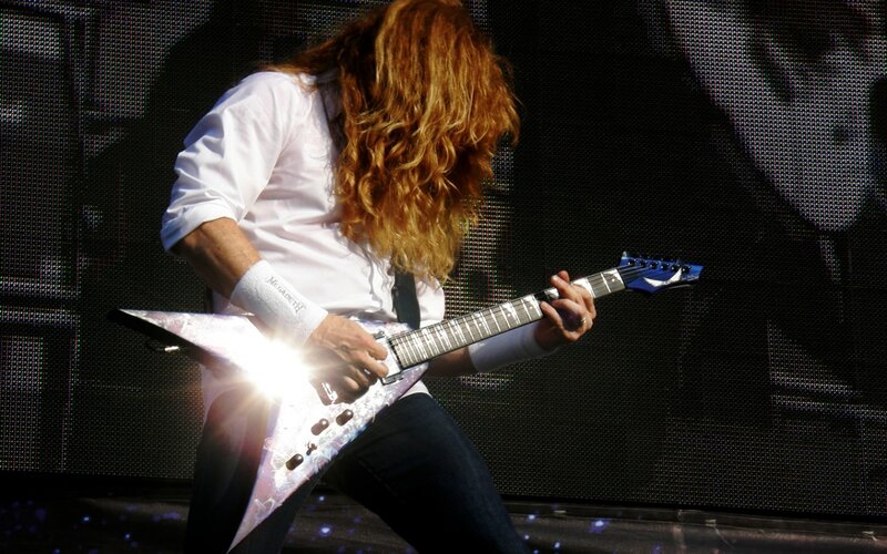 Guitarist Playing Electric Guitar — White