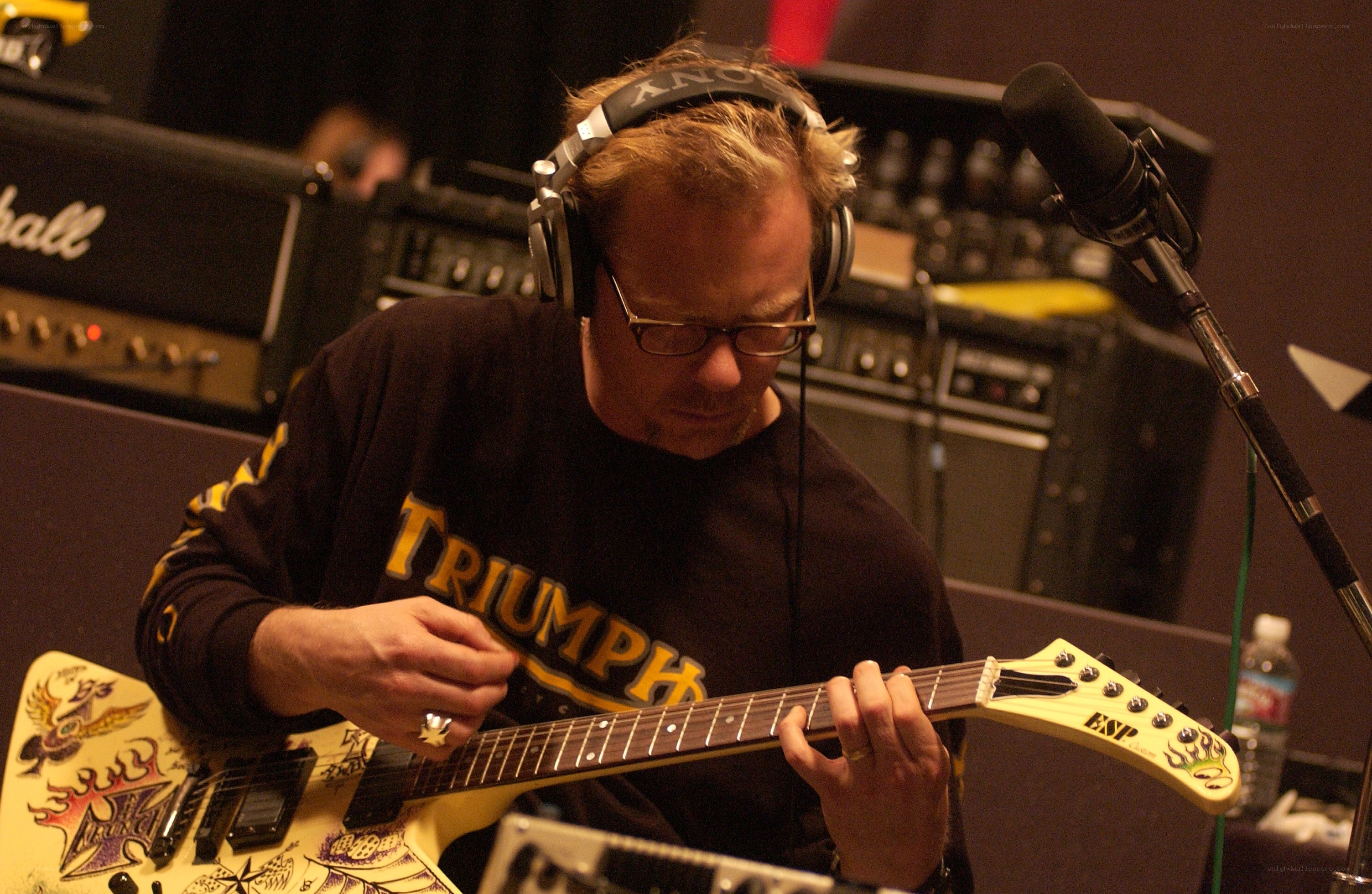 guitarist playing in a studio