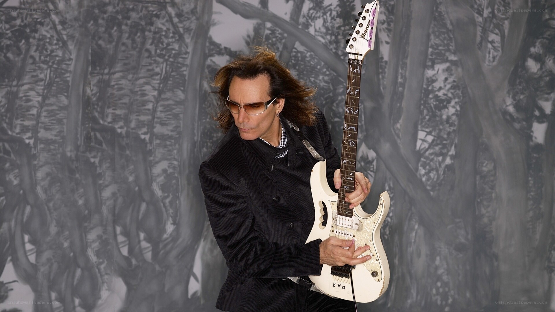 guitarist with white electric guitar