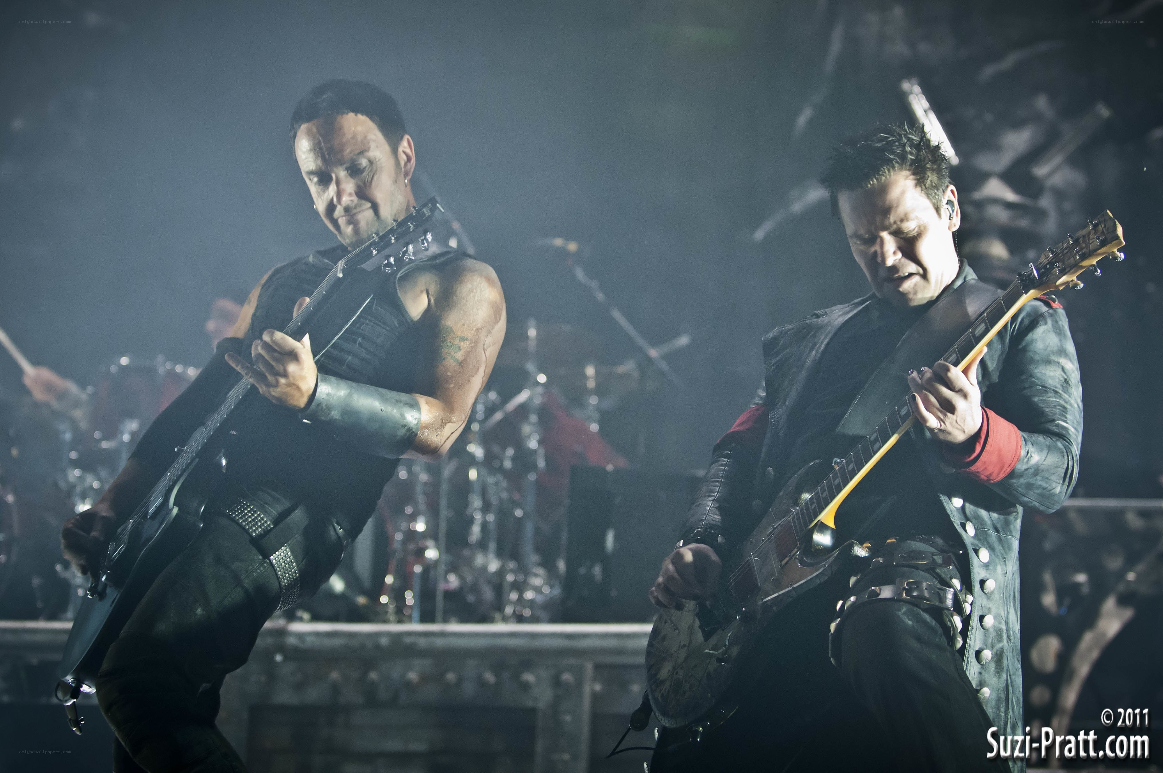 Guitarists performing on stage