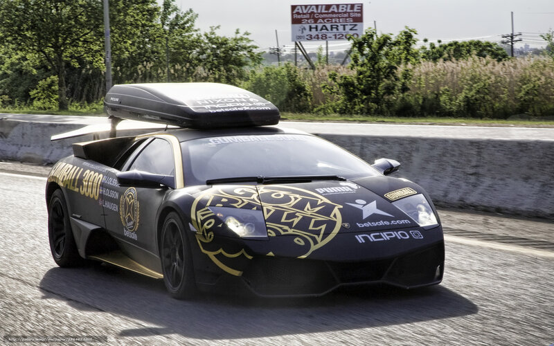 Gumball 3000 race car on road