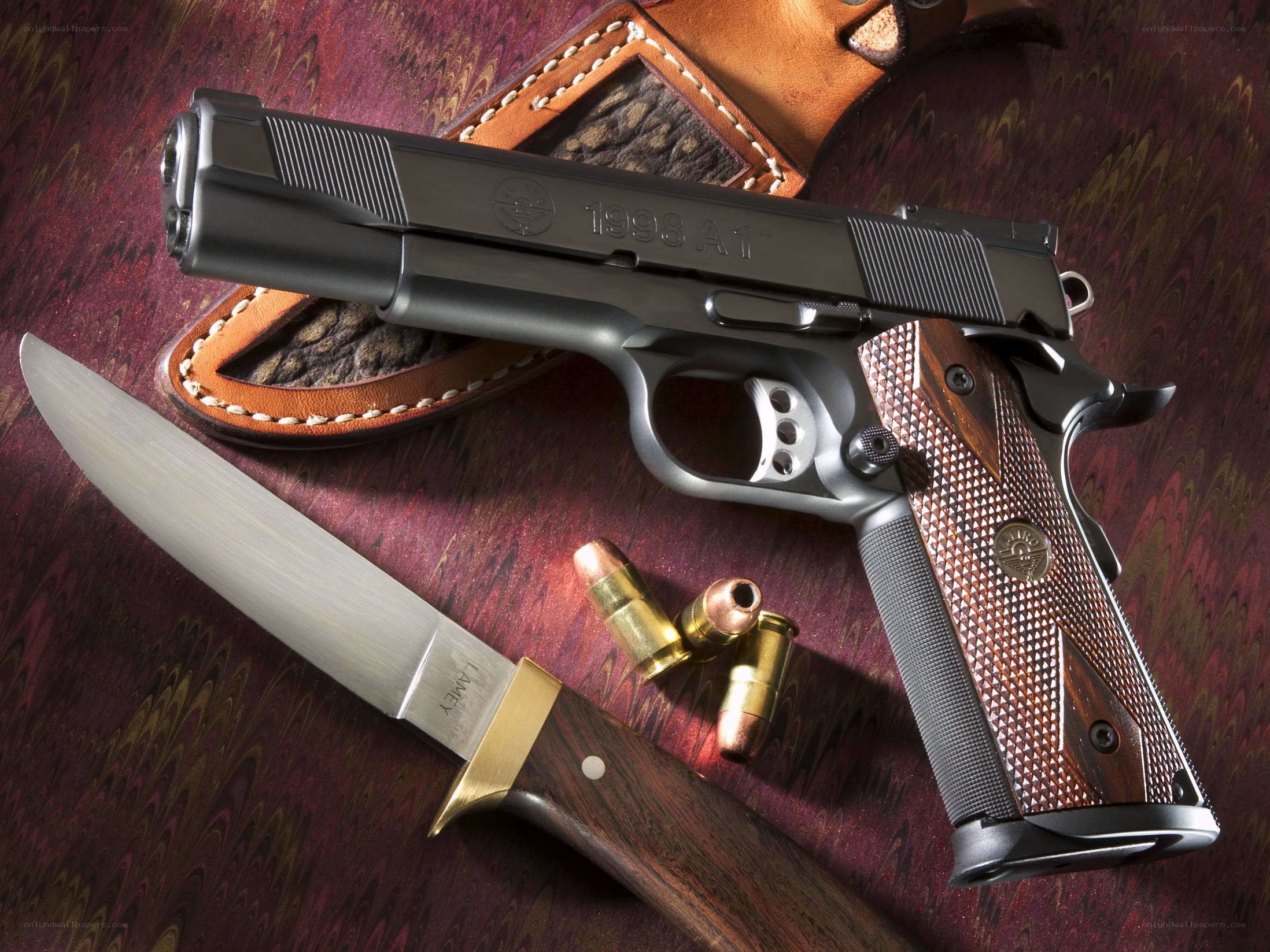 Gun and knife on marbled surface