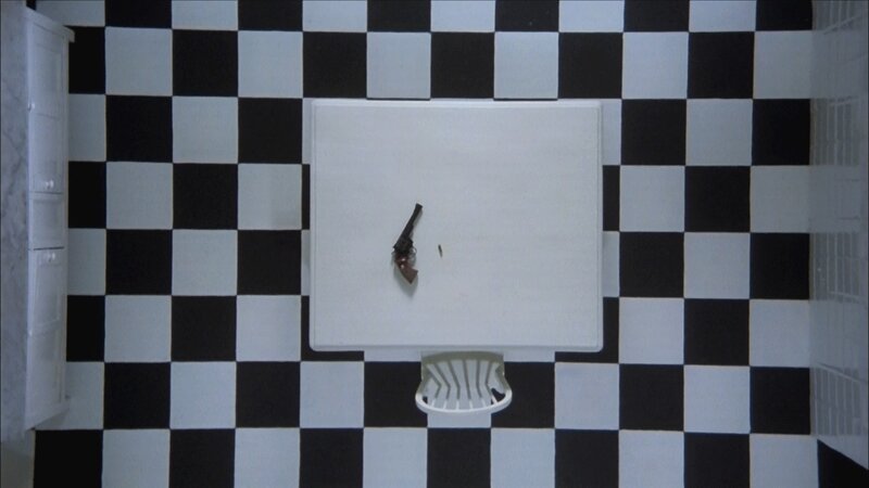 Gun on a white table