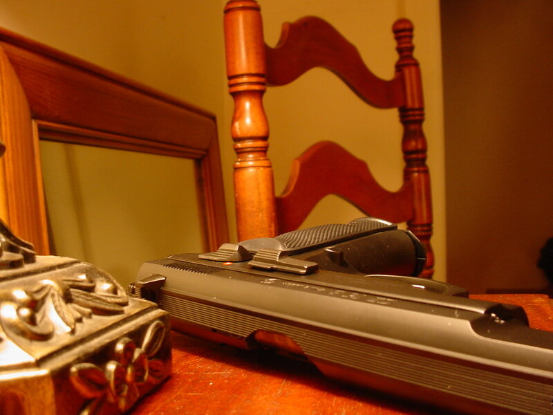 Gun on wooden table