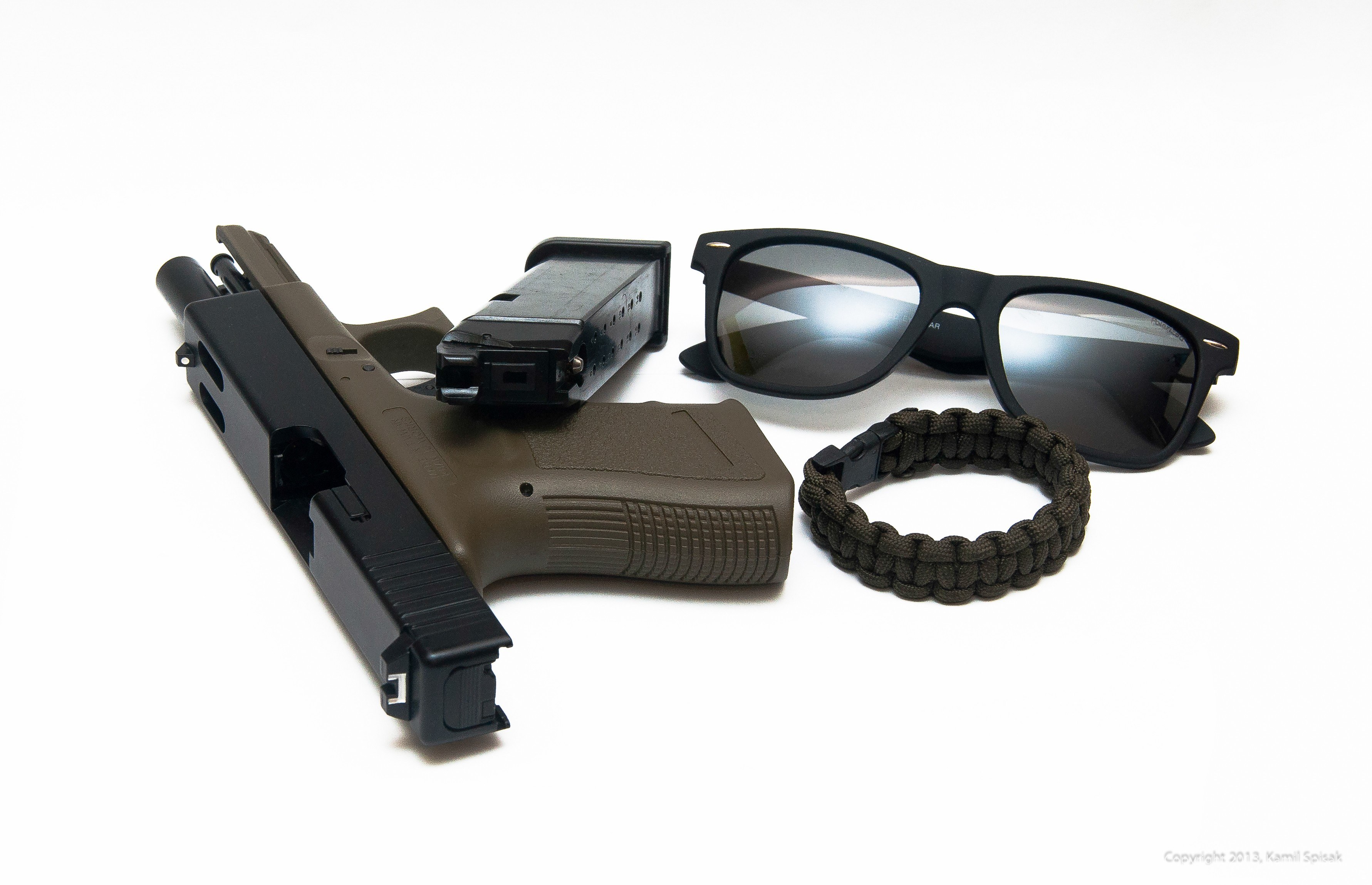 Gun with accessories on white