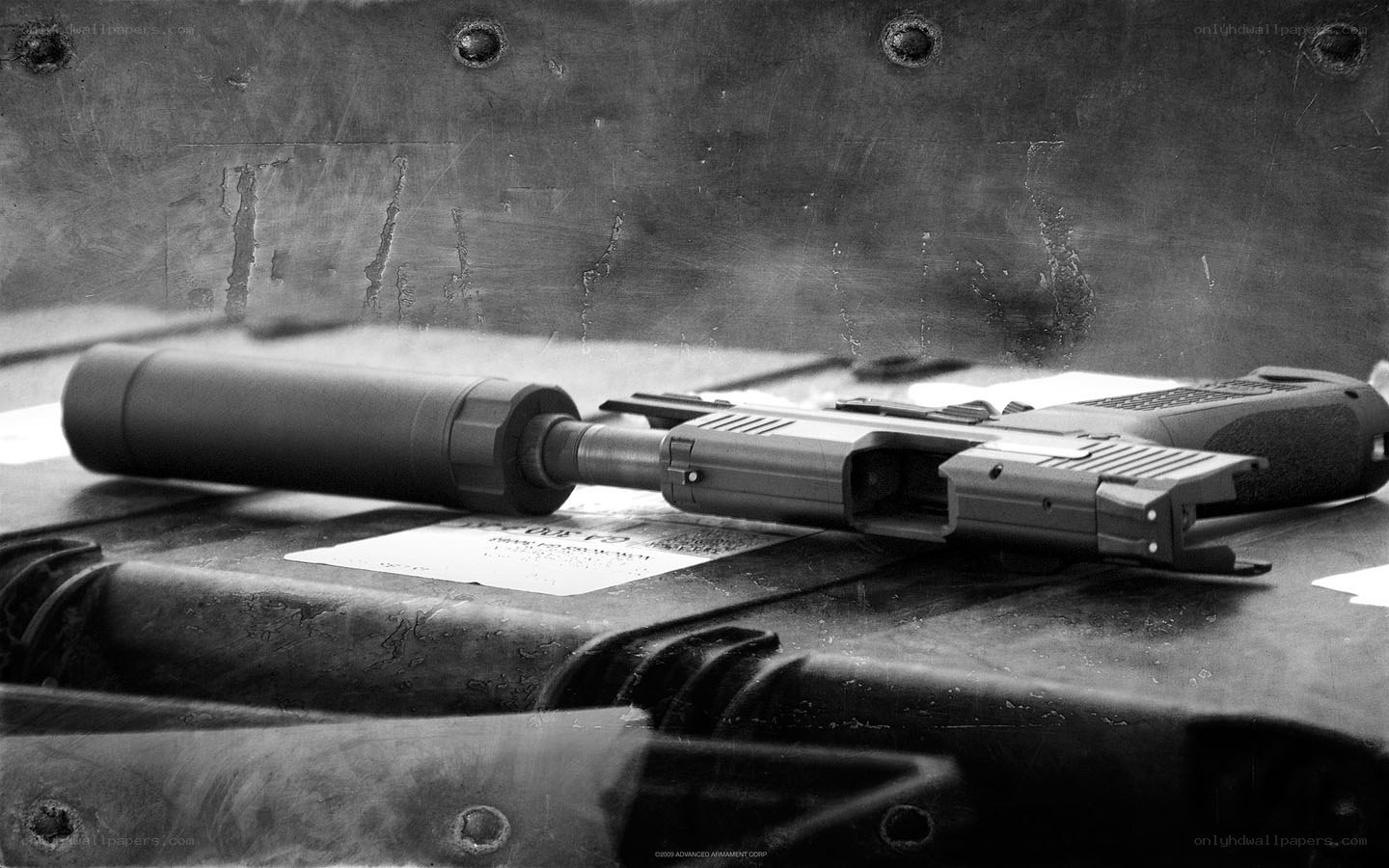 Gun with suppressor on case