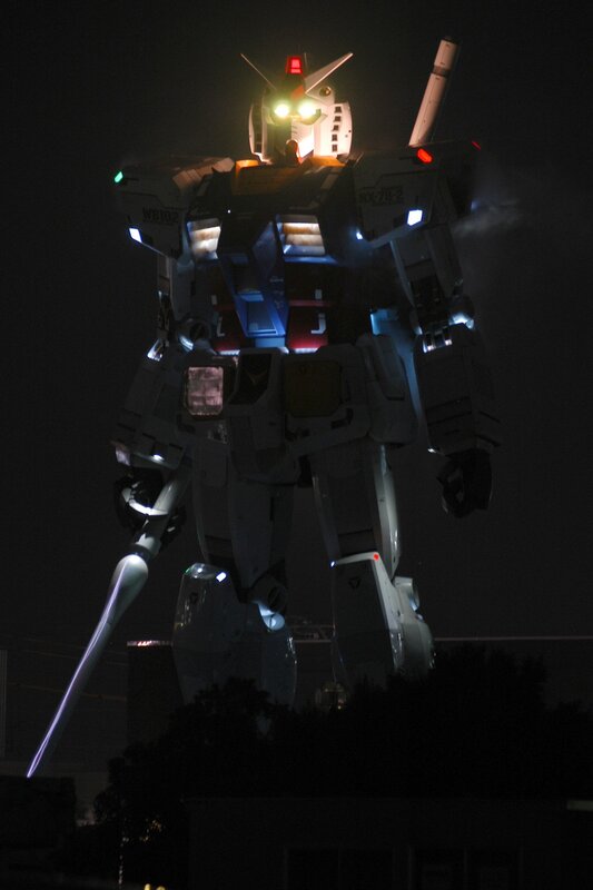 Gundam robot statue at night