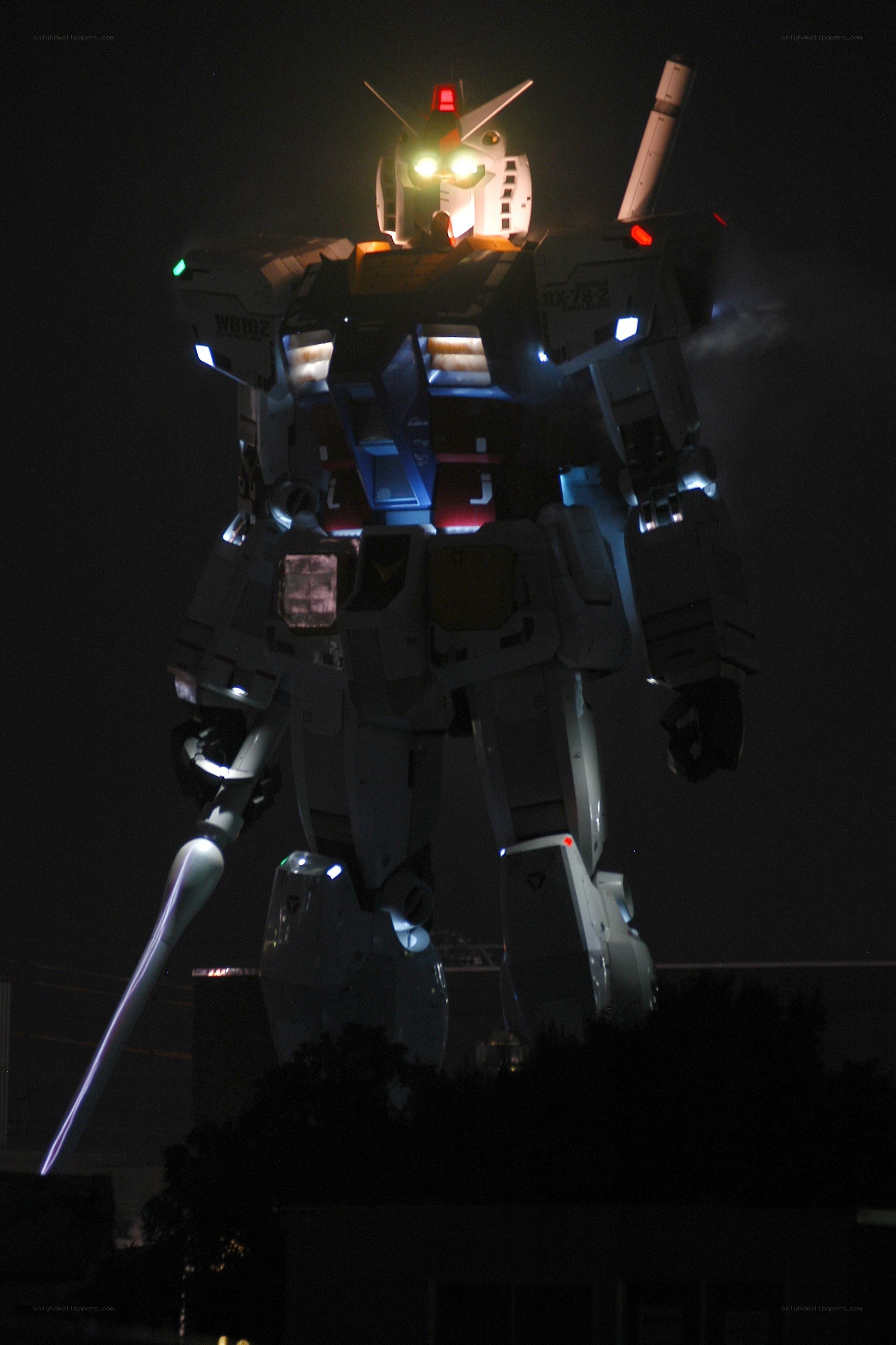 Gundam robot statue at night