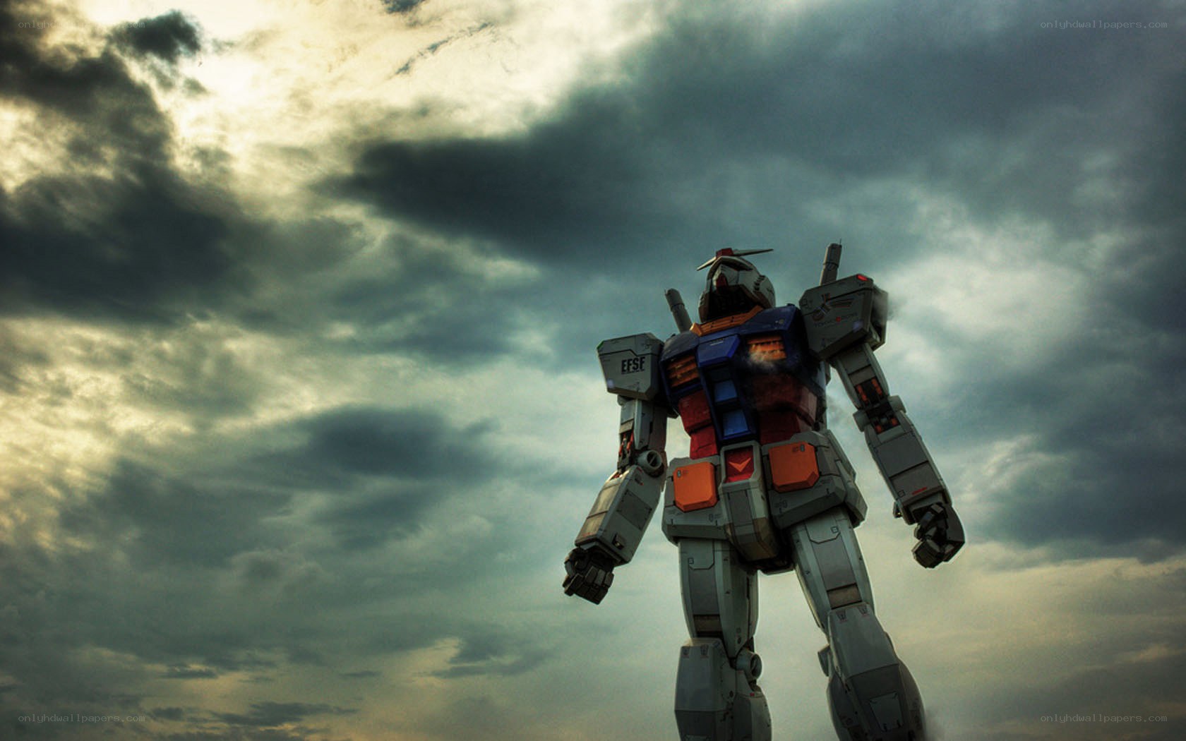 Gundam robot under stormy sky