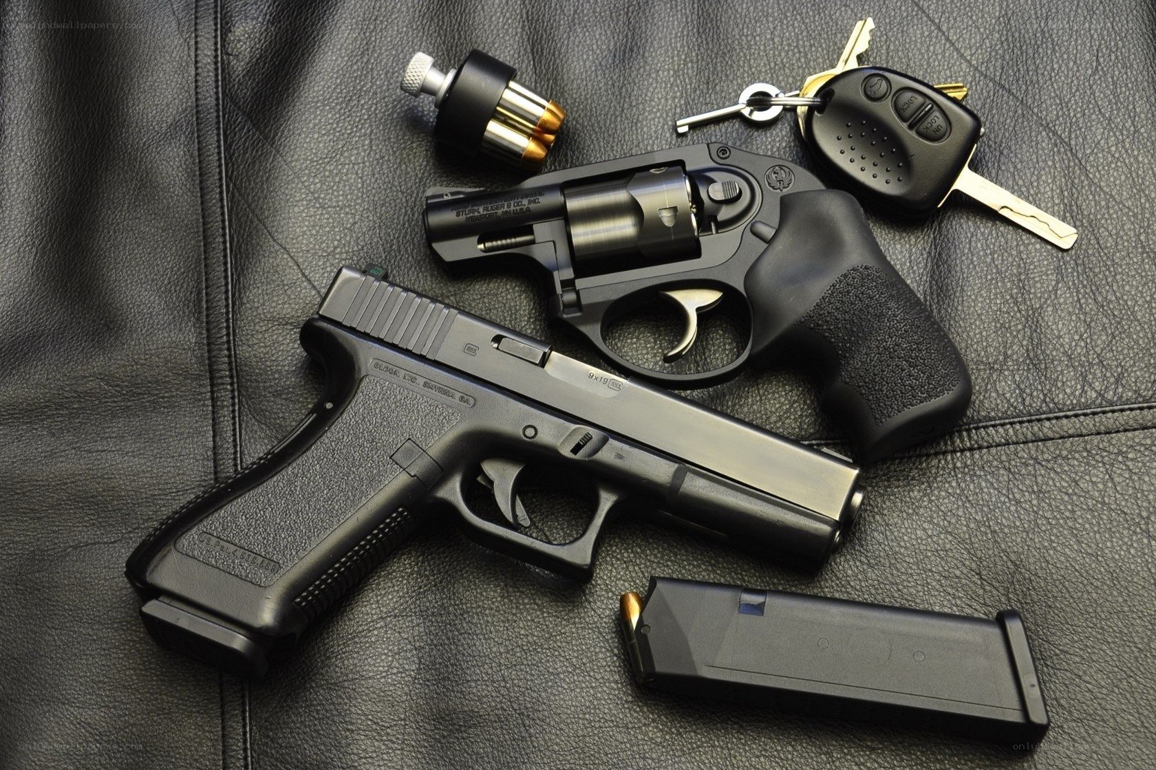 Guns and keys on leather