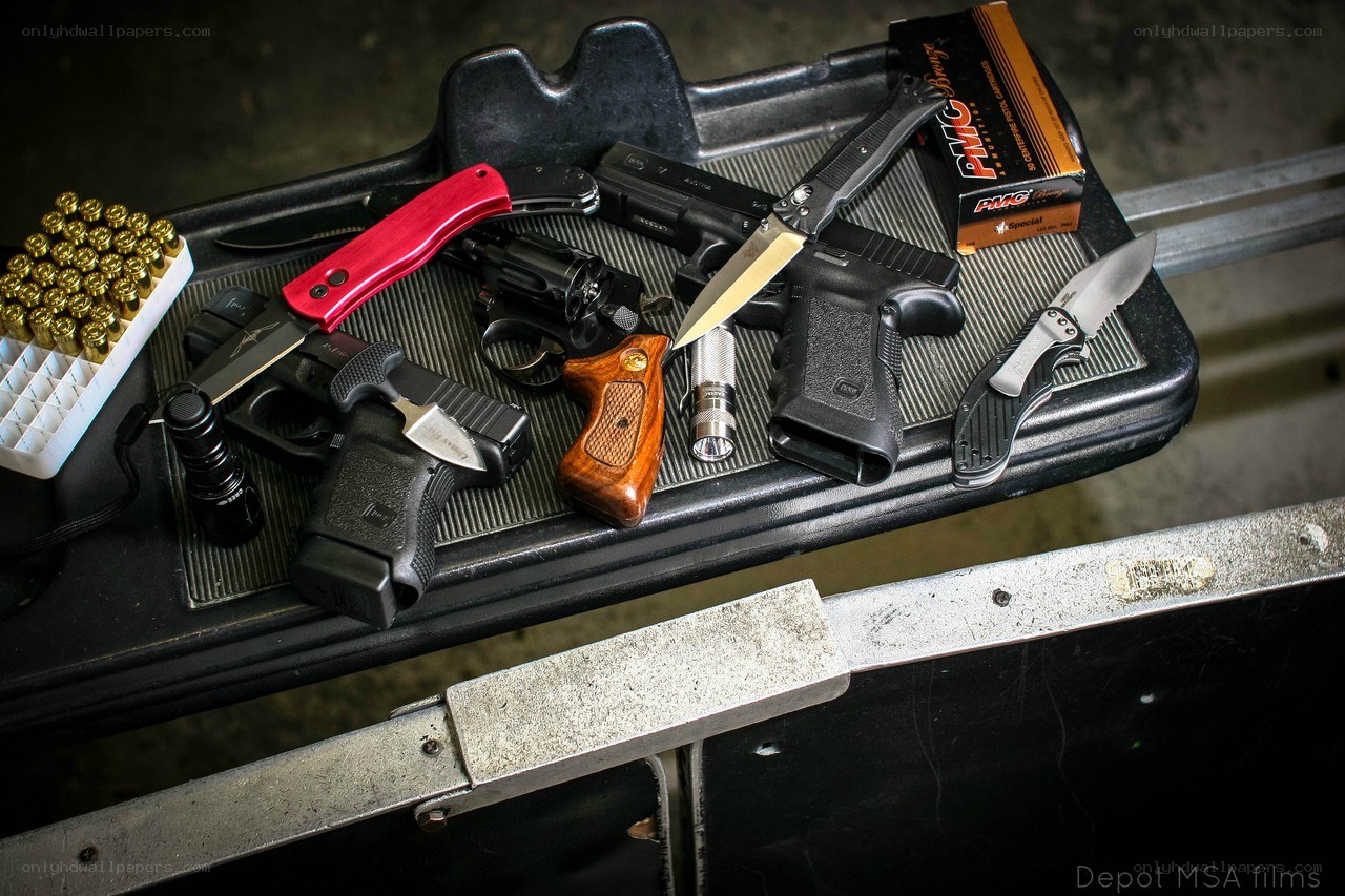 Guns and knives on a tray