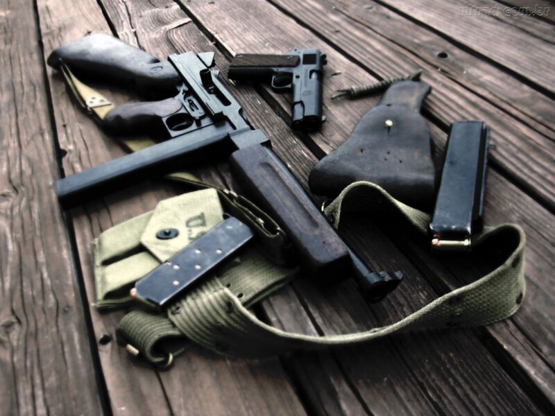 Guns on Wooden Surface