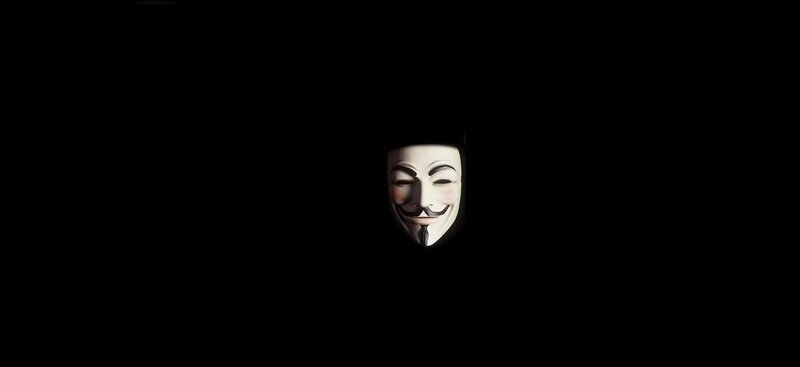 Guy Fawkes mask in darkness