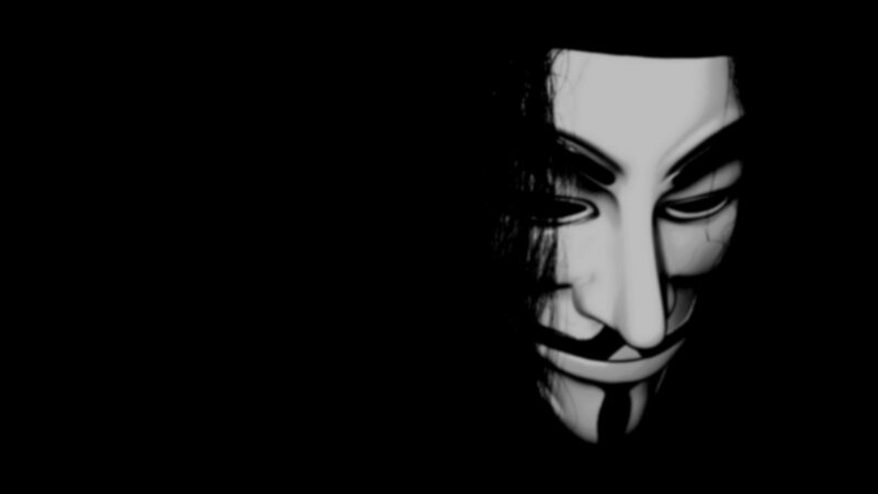 Guy Fawkes mask in darkness