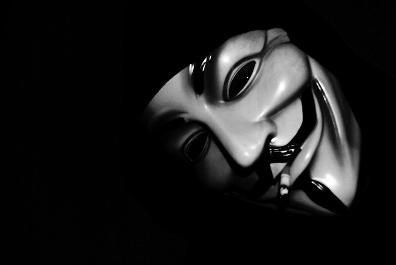 Guy Fawkes mask in darkness