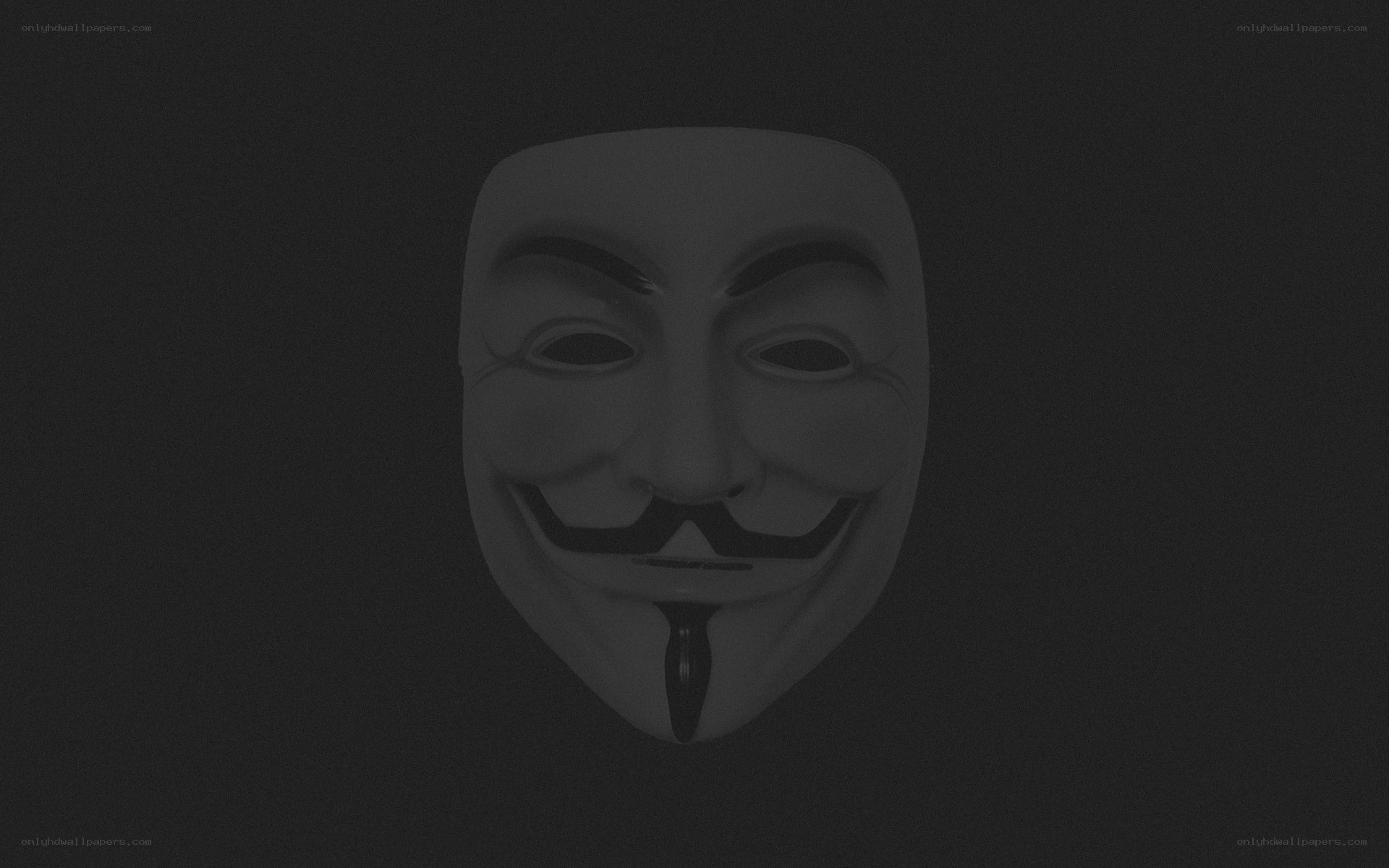 Guy Fawkes mask on dark background