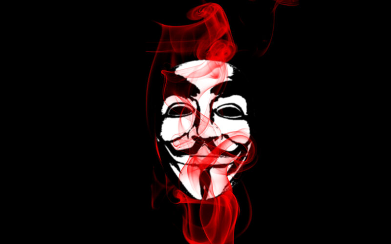 Guy Fawkes mask with red smoke