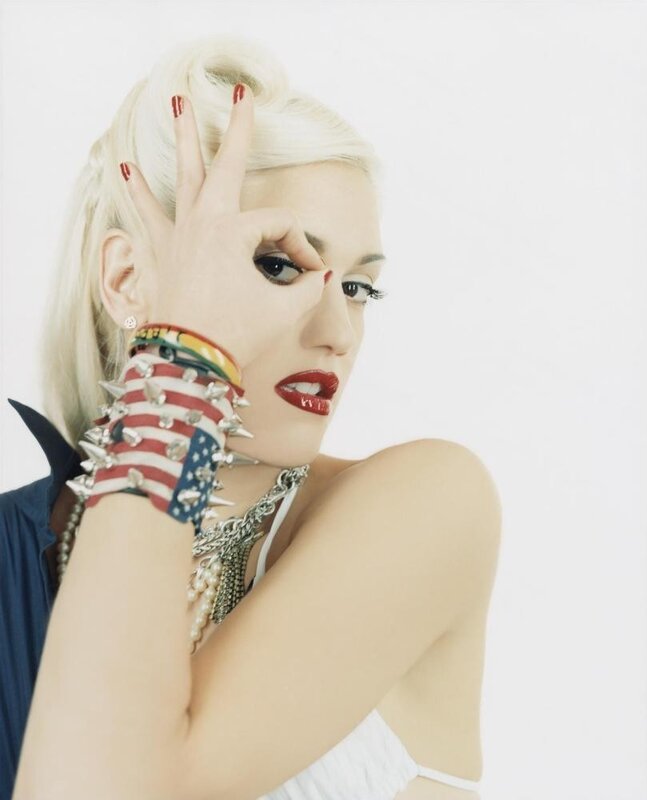 Gwen Stefani making a hand gesture