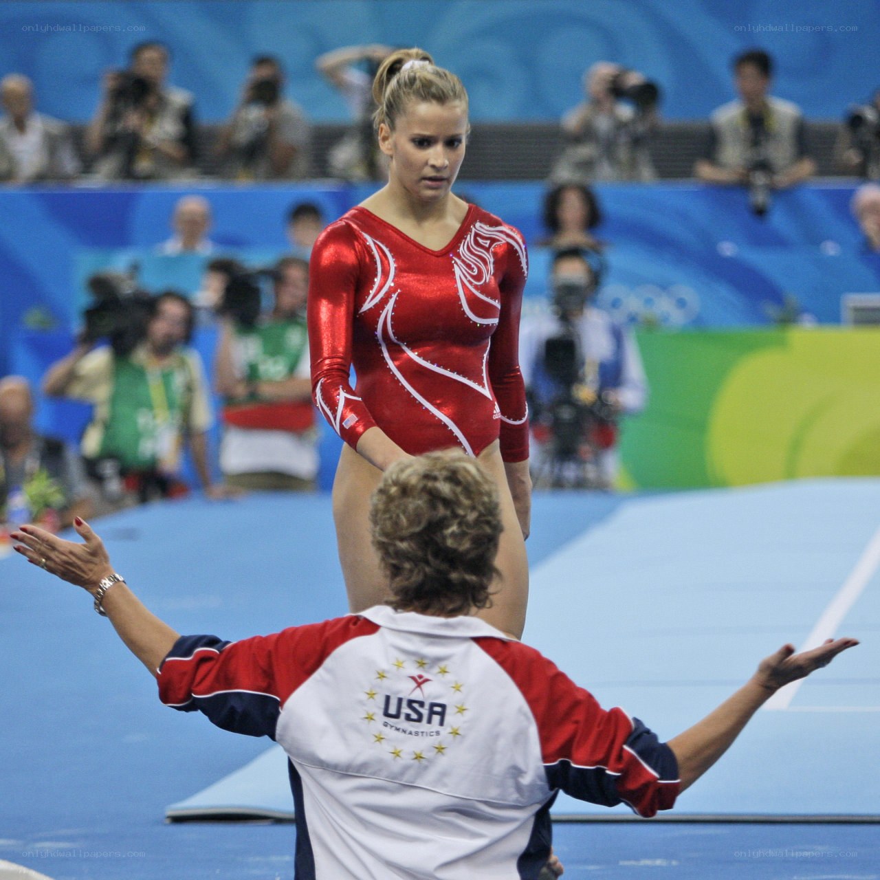 Gymnast and coach on floor