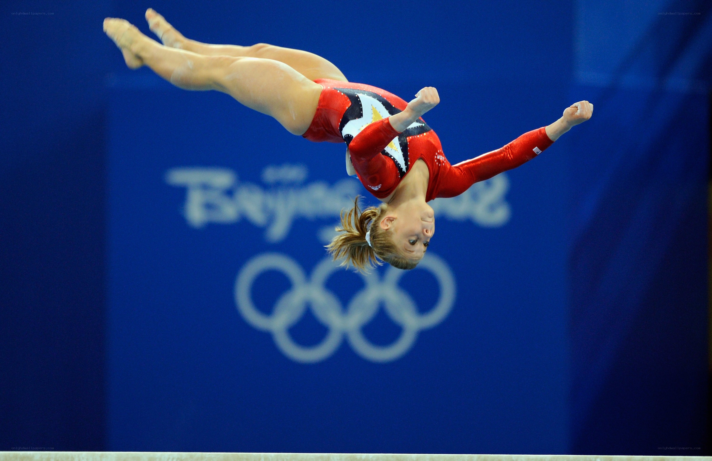 gymnast in mid-air flip