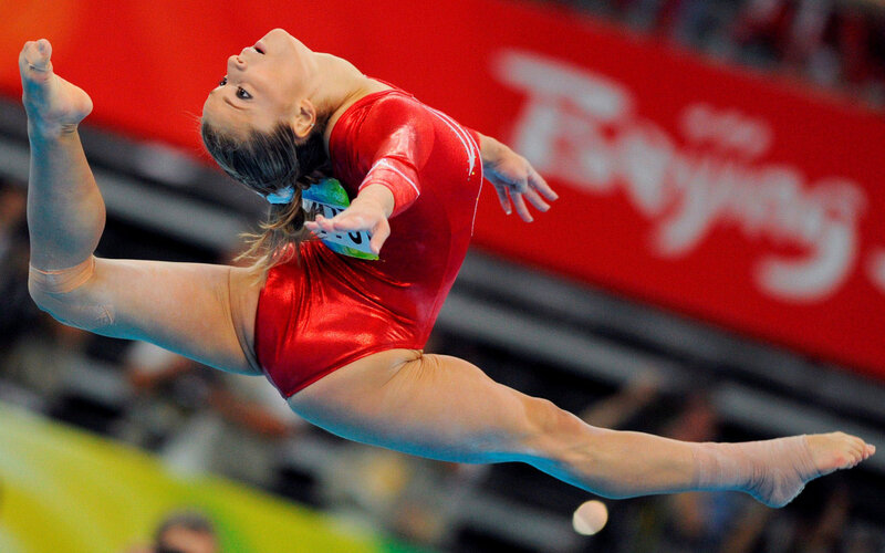 Gymnast in Red Leotard — Dynamic