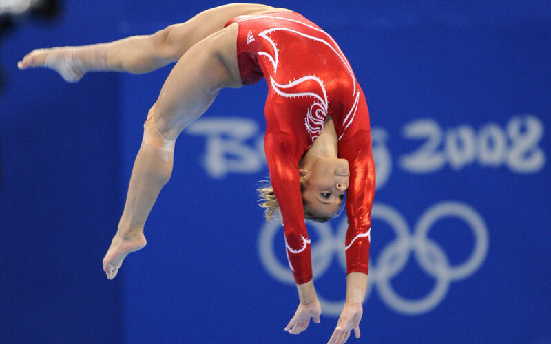 Gymnast in Red Leotard — Focused, Photograph