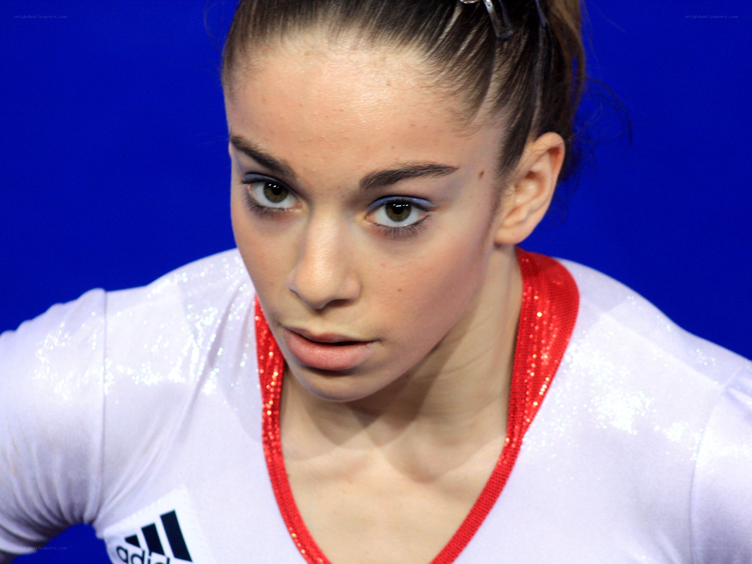 gymnast in white leotard