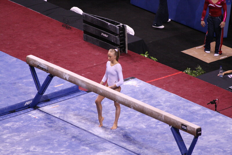 Gymnast on Balance Beam — Blue, Focused, Photograph