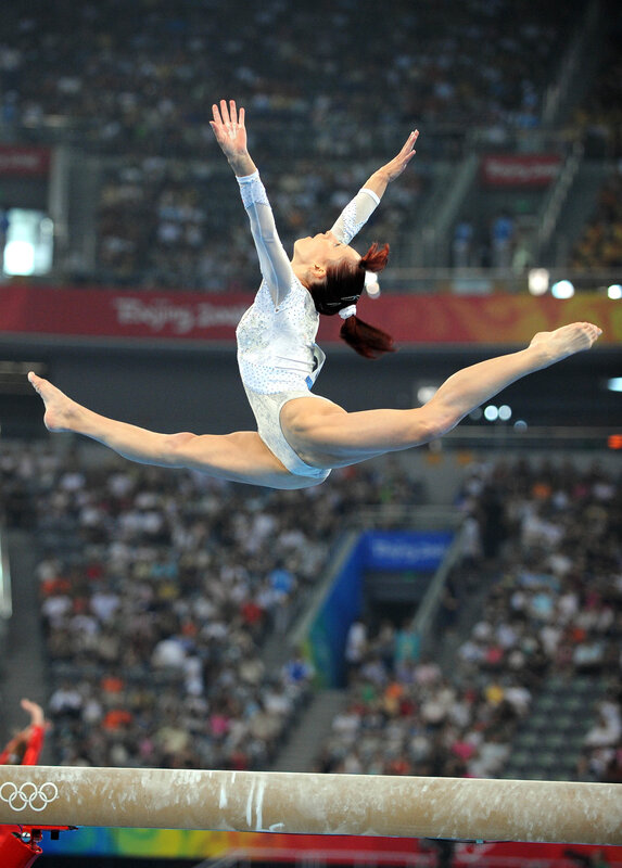 Gymnast on Balance Beam — White, Focused